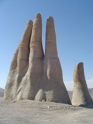 Illustration for article titled A mysterious, giant hand rises from the Chilean desert